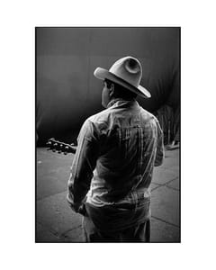 Black and white photograph of a man in a cowboy hat.